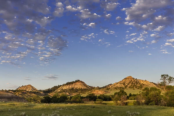 Late day light on badlands and ranch pastures near Miles City, Montana, USA