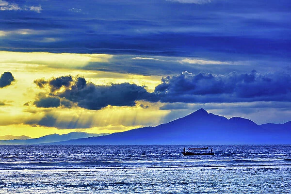 Late sunset view of Mount Agung volcano on the island of Bali, Indonesia. An active volcano rising 3, 014 meters (9, 888') is the second highest volcano in Indonesia. Gunung Agung (Great Mountain)