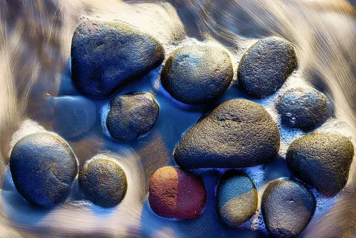Framed Print : Lava beach rocks worn by centuries of sea water cover the black sand beaches of Bali