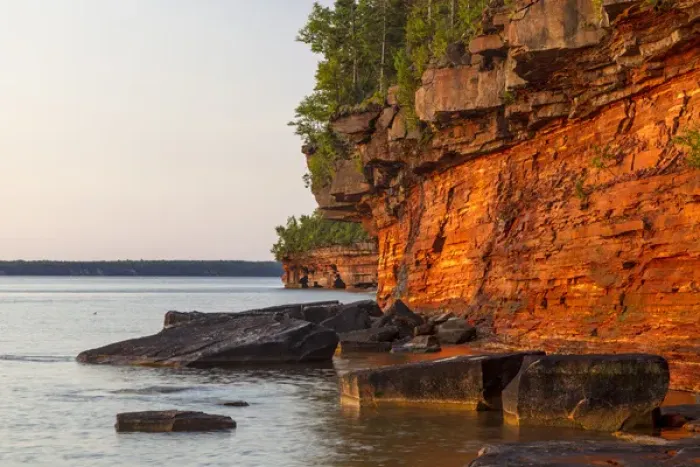 Framed Print : Layered sandstone cliffs and sea caves at sunrise on Devils Island in the Apostle Framed Print : Layered sandstone cliffs and sea caves at sunrise on Devils Island in the Apostle