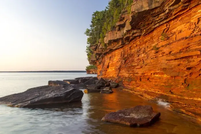 Framed Print : Layered sandstone cliffs and sea caves at sunrise on Devils Island in the Apostle Framed Print : Layered sandstone cliffs and sea caves at sunrise on Devils Island in the Apostle