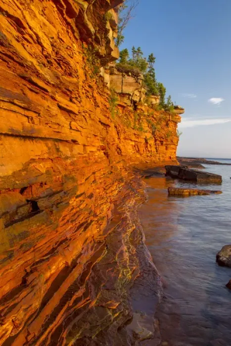 Framed Print : Layered sandstone cliffs and sea caves at sunrise on Devils Island in the Apostle Framed Print : Layered sandstone cliffs and sea caves at sunrise on Devils Island in the Apostle