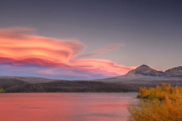 Lenticular clouds form over Divide Mountain and St Mary Lake in Glacier National Park