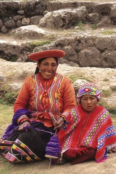 Life in Peru Cuzco in the mountains with native woman and her child in colors high elevation