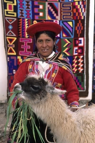 Life in Peru Cuzco in the mountains with native woman and her llama and color rug (MR)