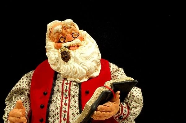 Still life. Simpich Caracter Doll, Santa reading book. Property released