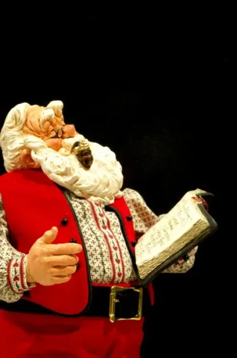 Framed Print : Still life. Simpich Caracter Doll, Santa reading book. Property released Framed Print : Still life. Simpich Caracter Doll, Santa reading book. Property released