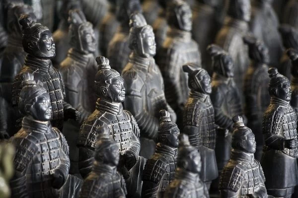 Life-size Imperial terra cotta warriors in battle formation stretch over the length
