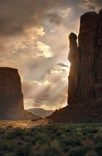 Light rays filter down into Monument Valley, on the Arizona and Utah border