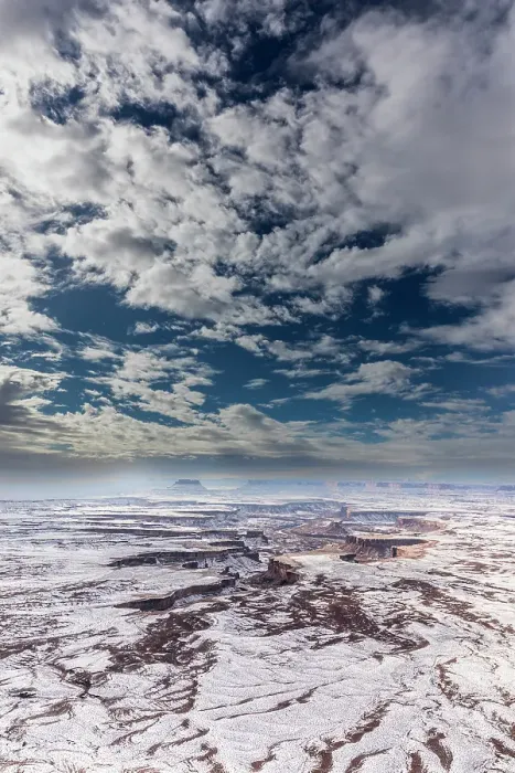 Framed Print : A light snowfall and contrasting orange-colored terrain define the rugged landscape of Canyonlands National Park