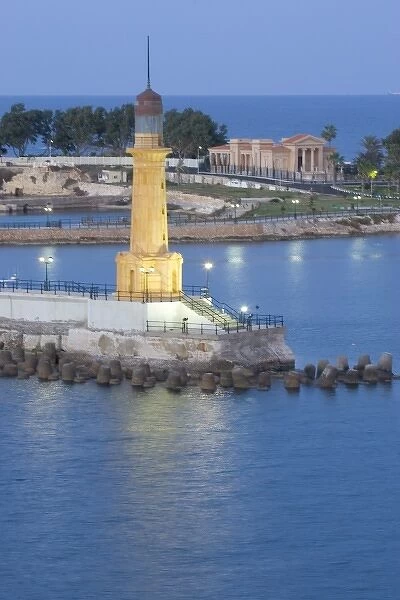 Lighthouse along the Jetty in Alexandria with a small harbor along the Mediterranean Sea, Egypt