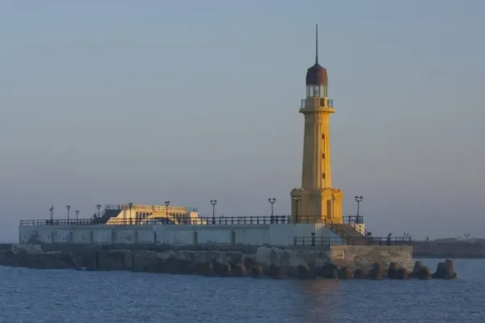 Framed Print : Lighthouse along the Jetty in Alexandria with a small harbor along the Mediterranean Sea, Egypt Framed Print : Lighthouse along the Jetty in Alexandria with a small harbor along the Mediterranean Sea, Egypt