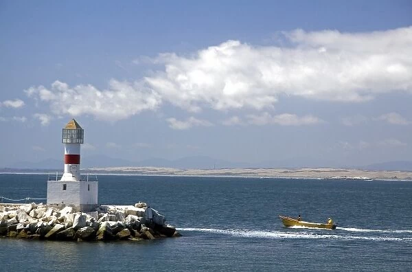 Lighthouse and motor boat off the coast of Concon in the Valparaiso Region of Chile