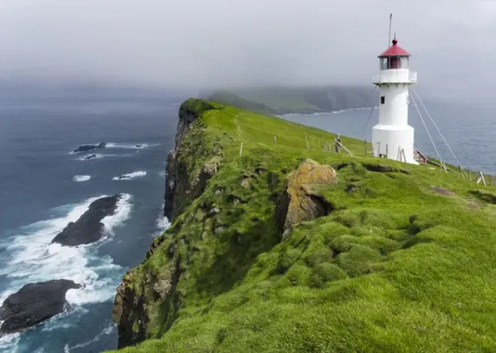 Framed Print : The lighthouse on Mykinesholmur. The island Mykines, part of the Faroe Islands in Framed Print : The lighthouse on Mykinesholmur. The island Mykines, part of the Faroe Islands in