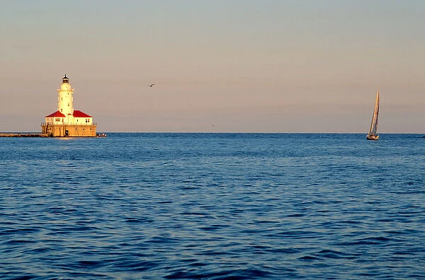 A lighthouse and sailboat on Lake Michigan, Chicago, Illinois. lighthouse