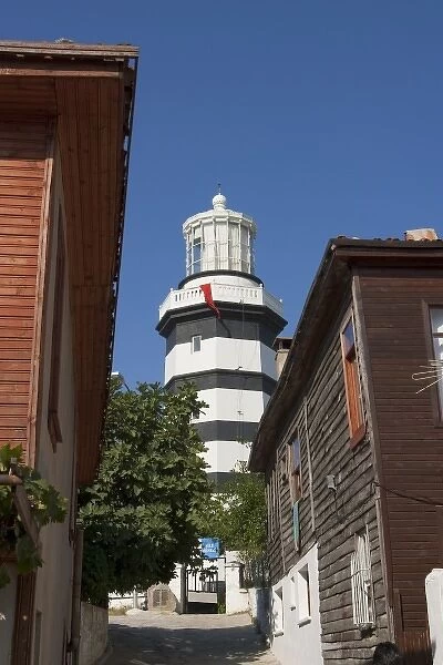 Lighthouse of Sile as seen behind old wooden houses, Istanbul, Turkey