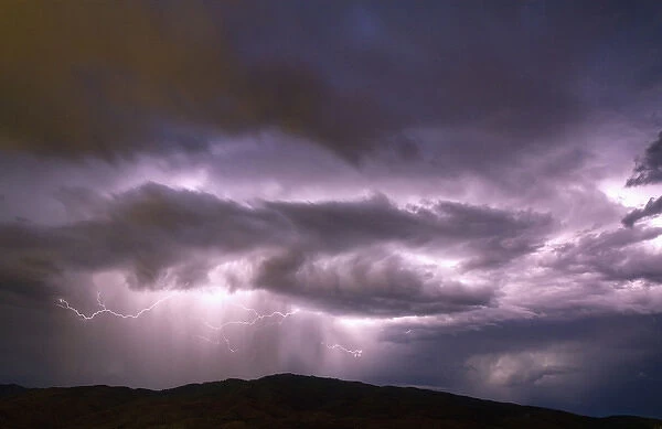 Lightning strikes during a thunderstorm on the first day of summer in Boise, Idaho, USA