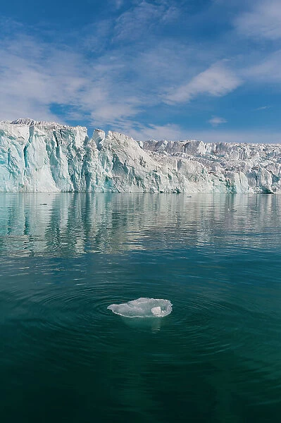 Lilliehook Glacier reflects on arctic waters. Lilliehookfjorden, Spitsbergen Island, Svalbard, Norway