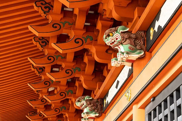 The lion dogs, Komainu, guarding the entrance of a Shinto shrine