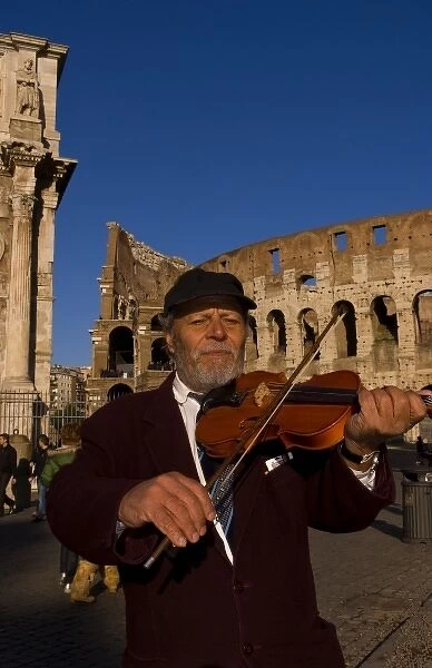 Local man playing violin at famous Colosseum in Rome Italy Landmark Monument in Europe
