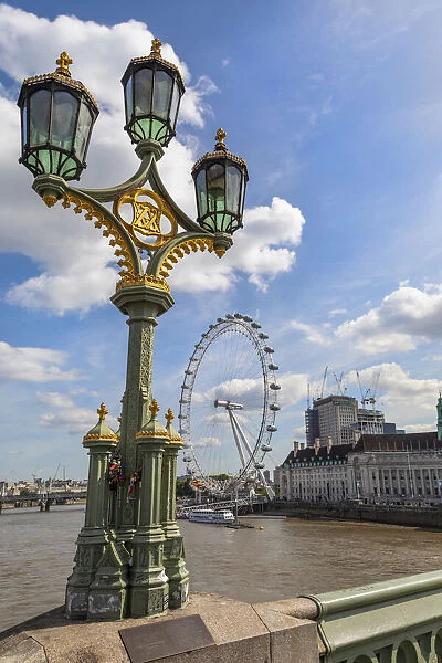 The London Eye and iconic British lamppost in London, England
