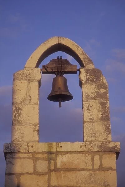 A lone bell hangs in the bell tower of the Church of Saint Nicholas (13th century)