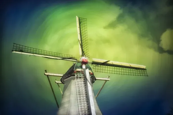 Framed Print : A lone windmill stands against the blue-green sky and clouds in swirl pattern Framed Print : A lone windmill stands against the blue-green sky and clouds in swirl pattern