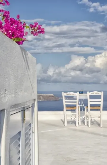 Framed Print : Two lonely romantic chairs on balcony with sky in Fira in Santorini Greece in Greek Framed Print : Two lonely romantic chairs on balcony with sky in Fira in Santorini Greece in Greek