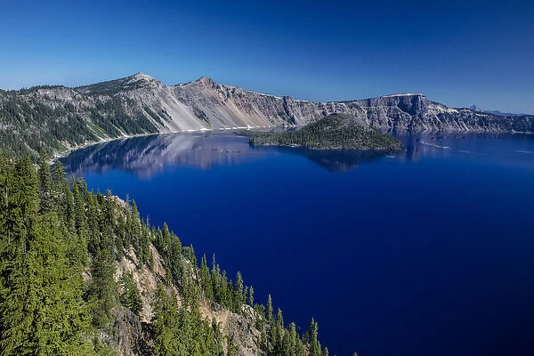 Looking down on blue waters of Crater Lake in Crater Lake National Park, Oregon, USA