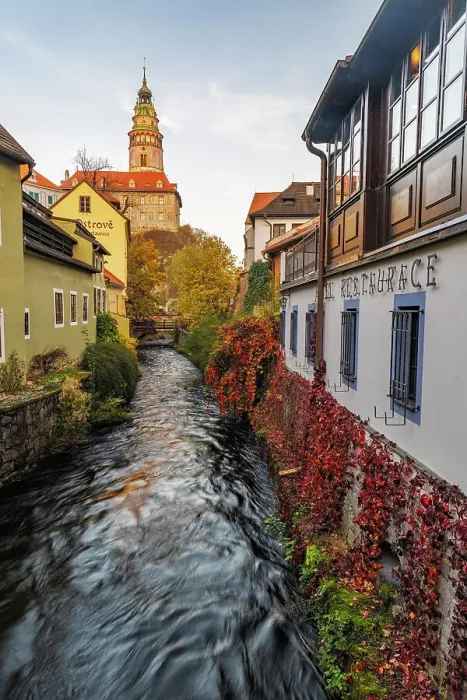 Framed Print : Looking down canal to Castle Tower in Cesky Krumlov, Czech Republic Framed Print : Looking down canal to Castle Tower in Cesky Krumlov, Czech Republic