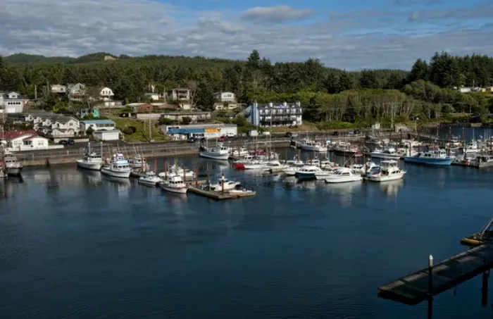 Framed Print : Looking down from above at Depoe Bay Oregon harbor with scenic colorful boats in pier