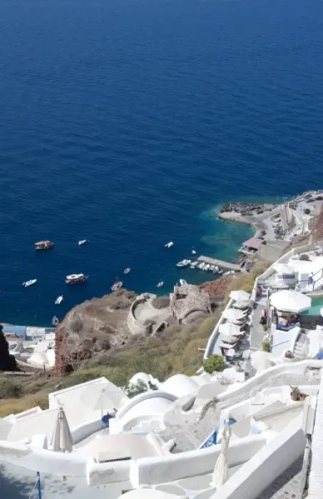 Framed Print : Looking down at fishing village in Oia in Santorini Greece in the Greek Islands Framed Print : Looking down at fishing village in Oia in Santorini Greece in the Greek Islands