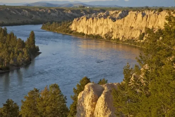 Framed Print : Looking down onto the Flathead River and the Mission Mountains from clay cliffs in