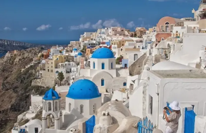 Framed Print : Looking down the steep cliffs of white buildings in beautiful Oia in Santorini in Framed Print : Looking down the steep cliffs of white buildings in beautiful Oia in Santorini in