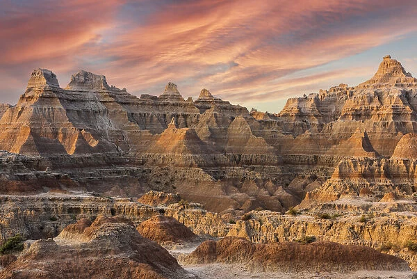 Magnificent set of striated hoodoos set against the backdrop of sunset colors in the sky