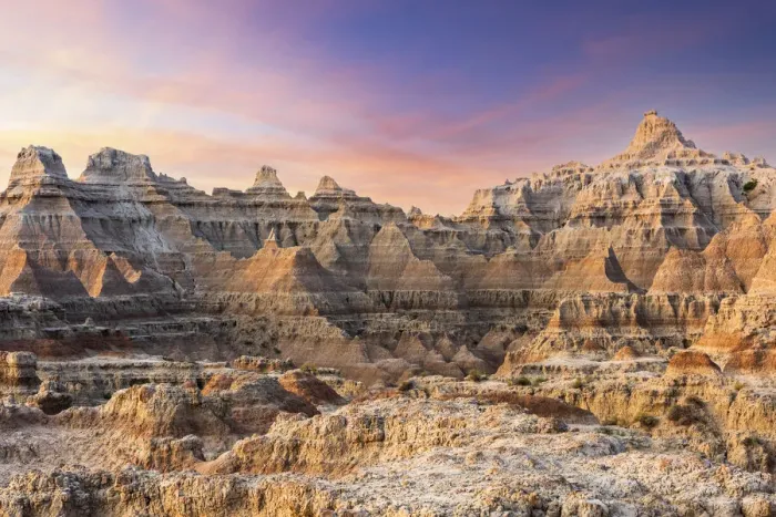 Framed Print : Magnificent set of striated hoodoos set against the backdrop of sunset colors in the sky Framed Print : Magnificent set of striated hoodoos set against the backdrop of sunset colors in the sky