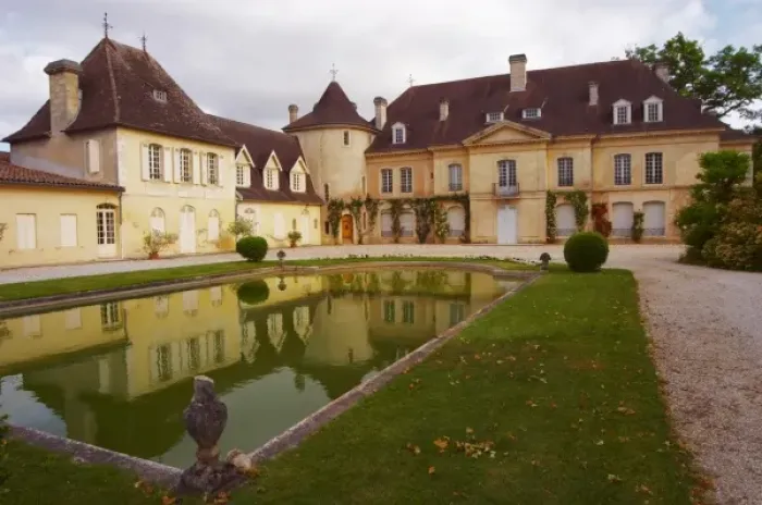 Framed Print : The main chateau building with its tower and a pond showing a reflection Chateau