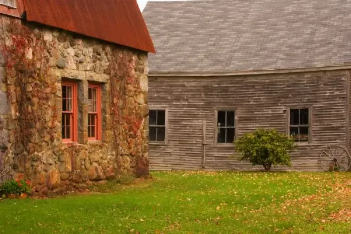 Framed Print : Maine, Old stone building and wooden barn in fall in rural New England