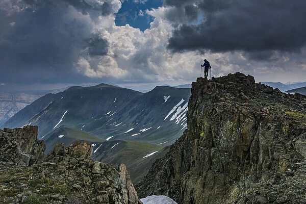 Male climber on ridge, Absaroka Mountains near Cody and Meeteetse, Wyoming, USA