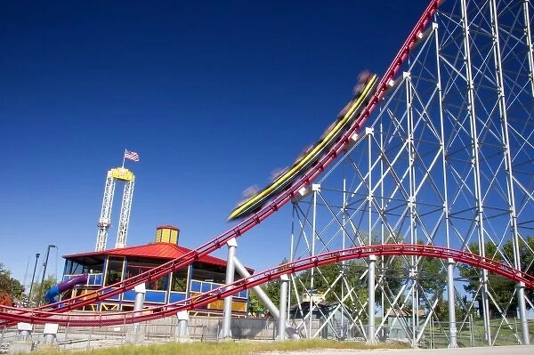 The Mamba roller coaster in motion at Worlds of Fun in Kansas City, Missouri