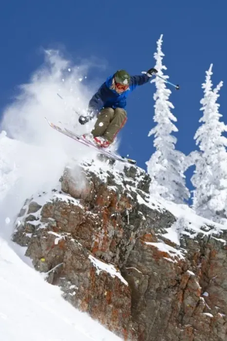 Framed Print : Man jumping colorful cliff and skiing in fresh powder at Whitefish Mountain Resort in Montana Framed Print : Man jumping colorful cliff and skiing in fresh powder at Whitefish Mountain Resort in Montana
