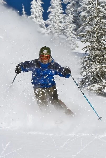 Man skiing in fresh powder at Whitefish Mountain Resort in Montana (MR)