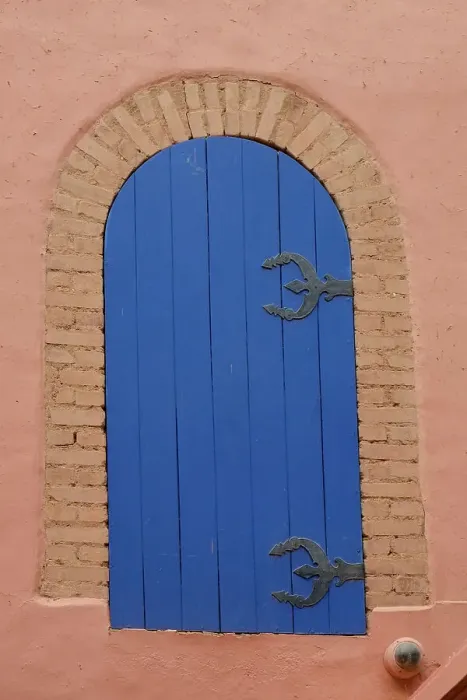 Framed Print : Marrakech, Morocco. Blue gate situated on old wall
