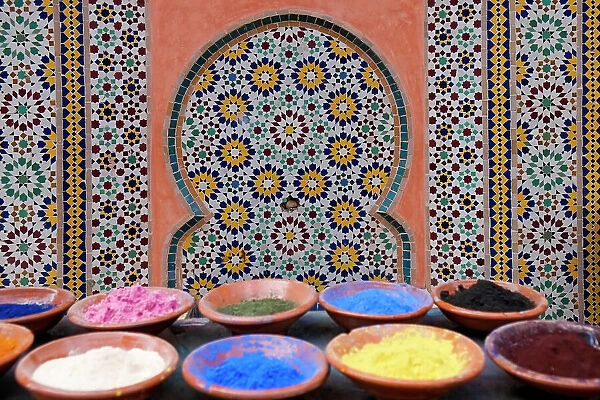 Marrakech, Morocco. Clay bowls of spices and bluing with tile background