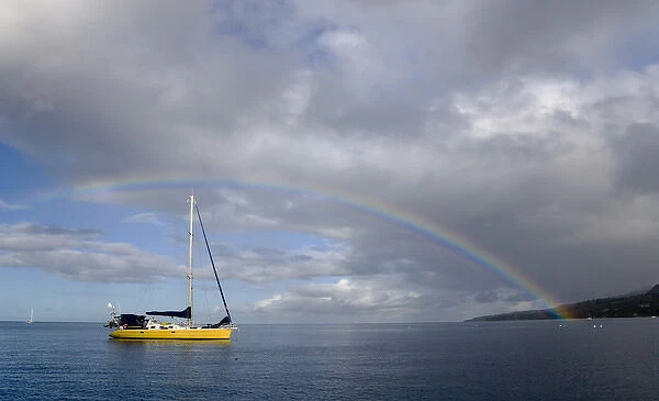 MARTINIQUE. French Antilles. West Indies. Rainbow over sailboat anchored in harbor at St