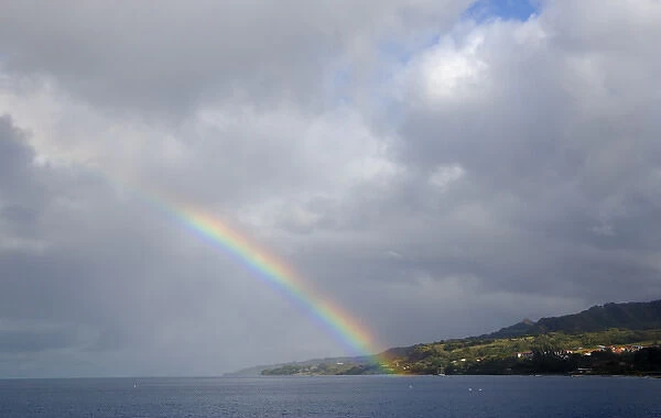 MARTINIQUE. French Antilles. West Indies. Rainbow over harbor at St. Pierre
