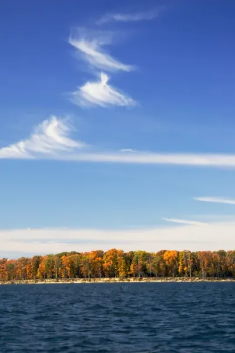 Framed Print : MARYLAND. USA. Cirrus fibratus clouds above colorful foliage & Chesapeake Bay in autumn Framed Print : MARYLAND. USA. Cirrus fibratus clouds above colorful foliage & Chesapeake Bay in autumn