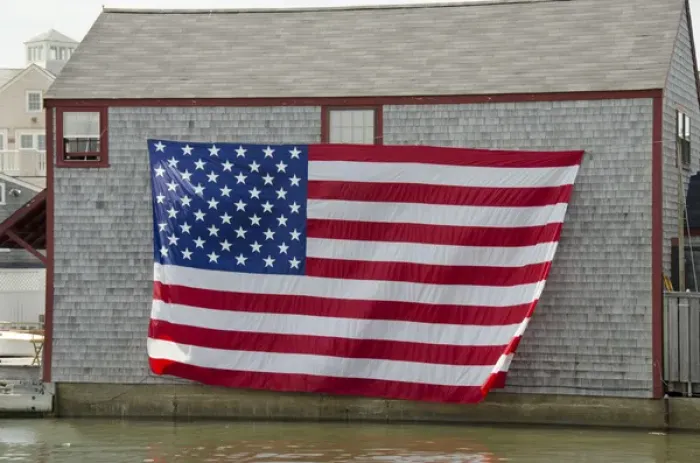 Framed Print : Massachusetts, New England, Nantucket. Large flag on the side of boathouse