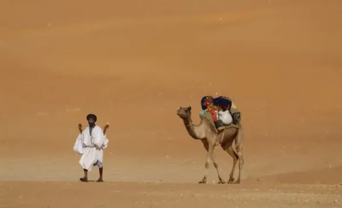 Framed Print : Mauritania, Route Espoir, Boutuilimit, A man with his dromedary