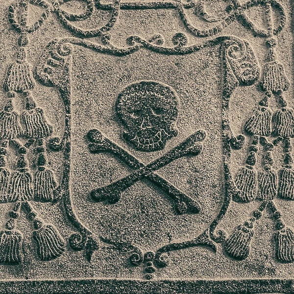 Melaka, West Malaysia. Skull and crossbones stone carving on old Portuguese tombstones in Melaka's ruined St. Paul's church